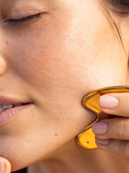 ["Face Oil and Gua Sha Duo ", " Model Image ", " Uncommon Beauty"]