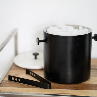 ["Black and Marble Ice Bucket ", " Lifestyle Image ", " Uncommon James Home"]