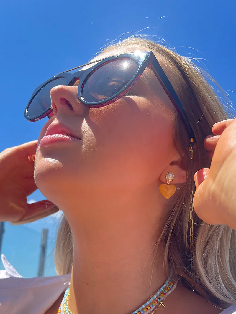 Sunglasses and Case Duo | Model Image | Uncommon Lifestyle