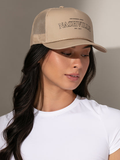 ["Nashville Trucker Hat ", " Beige ", " Model Image 2 ", " Uncommon Lifestyle"]