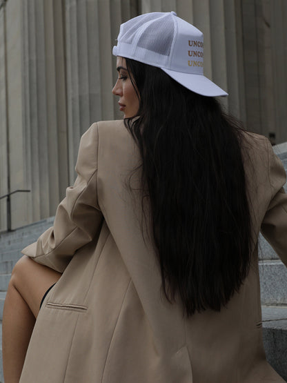 ["Uncommon Ombré Hat ", " White ", " Model Image 2 ", " Uncommon Lifestyle"]