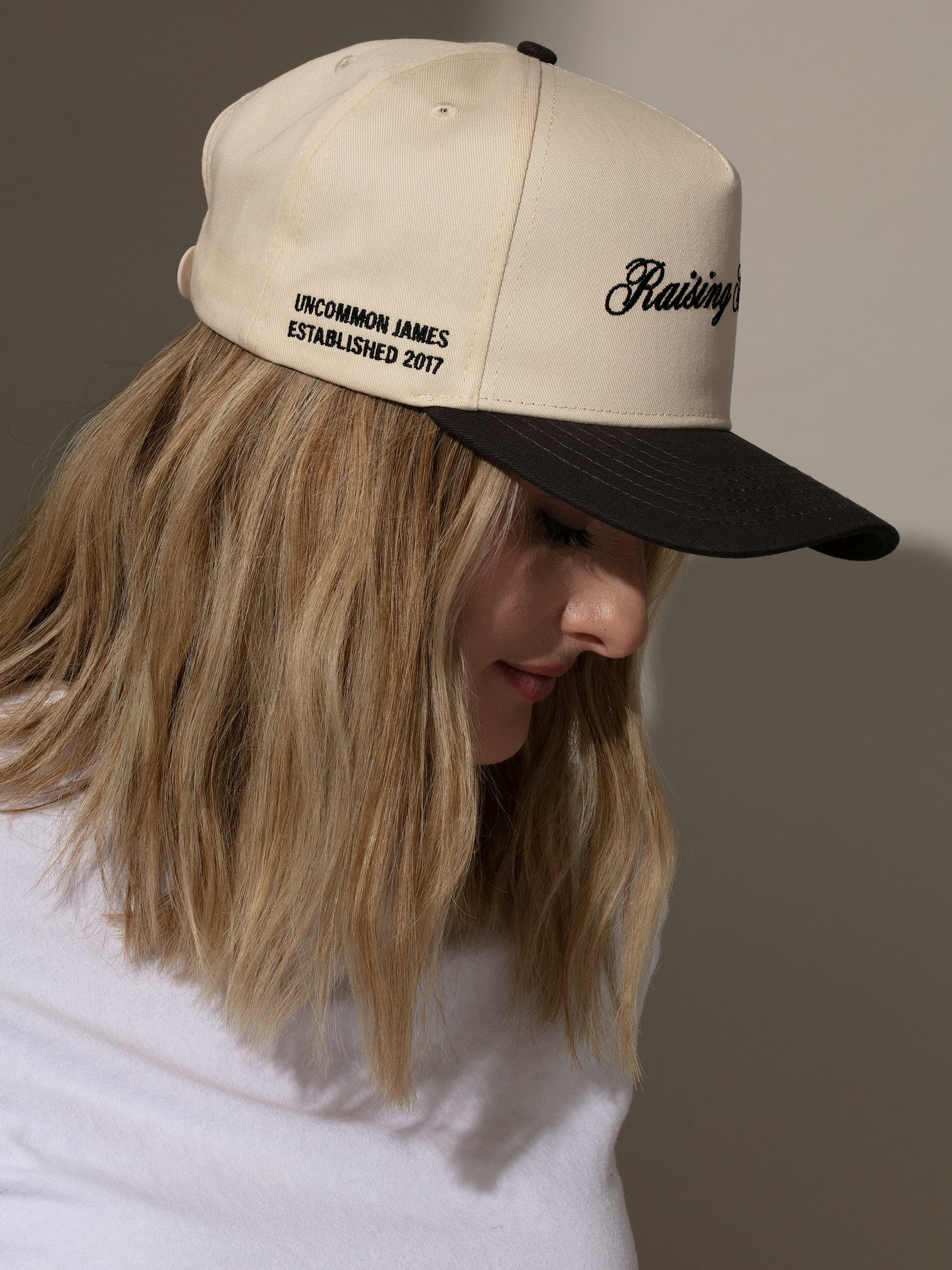 Raising Hell Trucker Hat | Charcoal/Tan | Model Image 3 | Uncommon Lifestyle