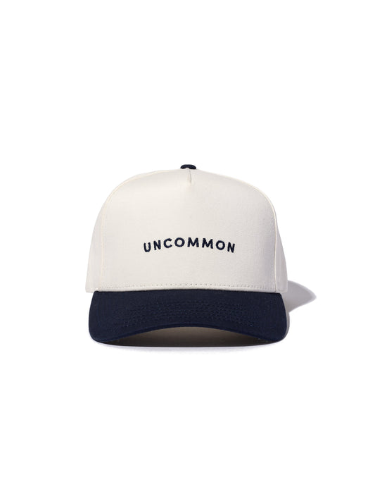 Simple Uncommon Trucker Hat | Navy/Cream | Model Image | Uncommon Lifestyle