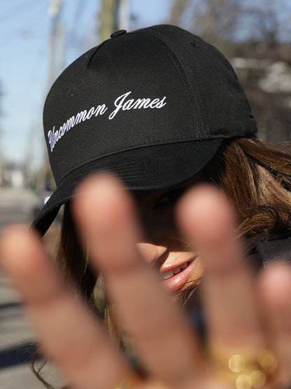 ["UJ Girl Trucker Hat ", " Black ", " Model Image ", " Uncommon Lifestyle"]
