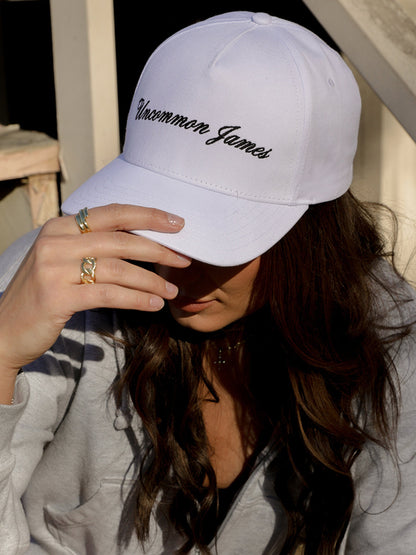 ["UJ Girl Trucker Hat ", " White ", " Model Image ", " Uncommon Lifestyle"]