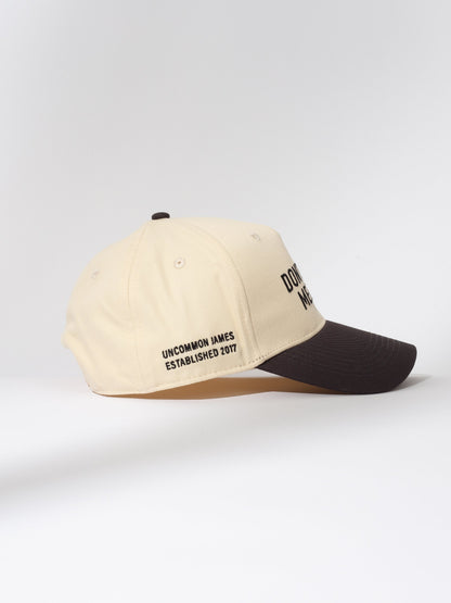 ["Don't Call Me Baby Trucker Hat ", " Ivory/Black ", " Product Image 2 ", " Uncommon Lifestyle"]