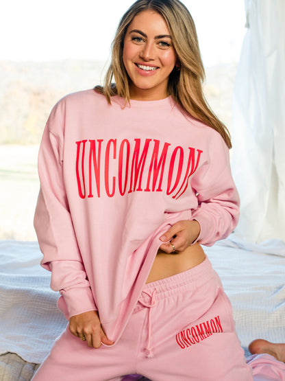["Forever Uncommon Sweatshirt ", "  Pink ", " Campaign Image ", " Uncommon Lifestyle"]