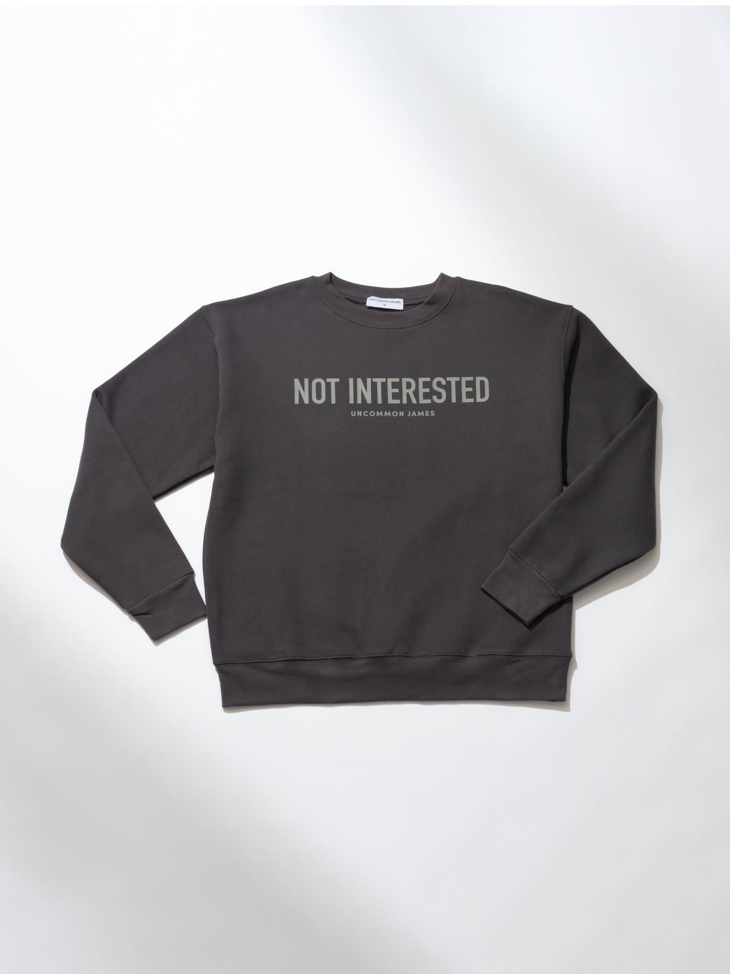 Not Interested Crewneck Sweatshirt | Dark Gray | Product Image | Uncommon Lifestyle