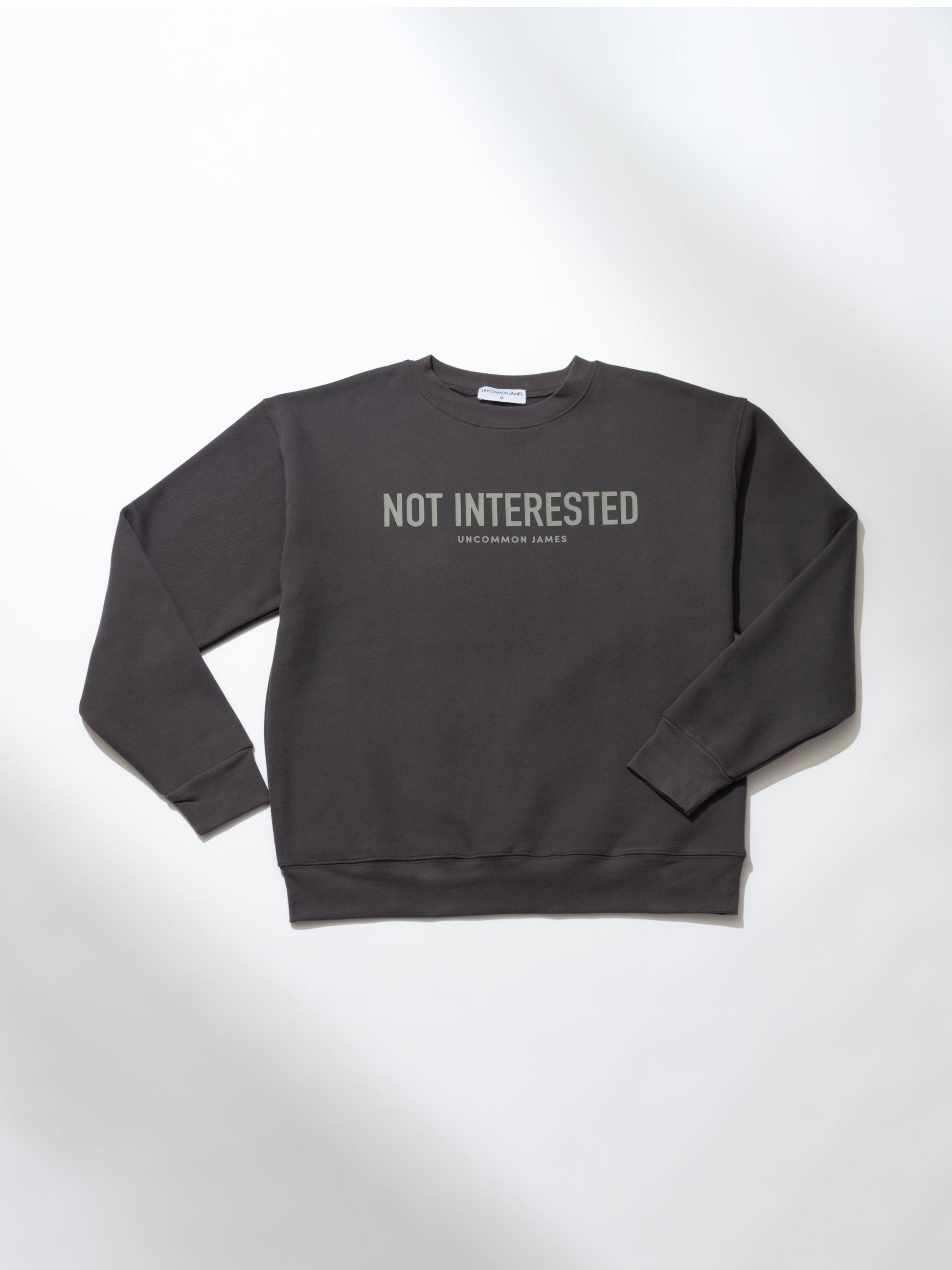 Not Interested Crewneck Sweatshirt | Dark Gray | Product Image | Uncommon Lifestyle