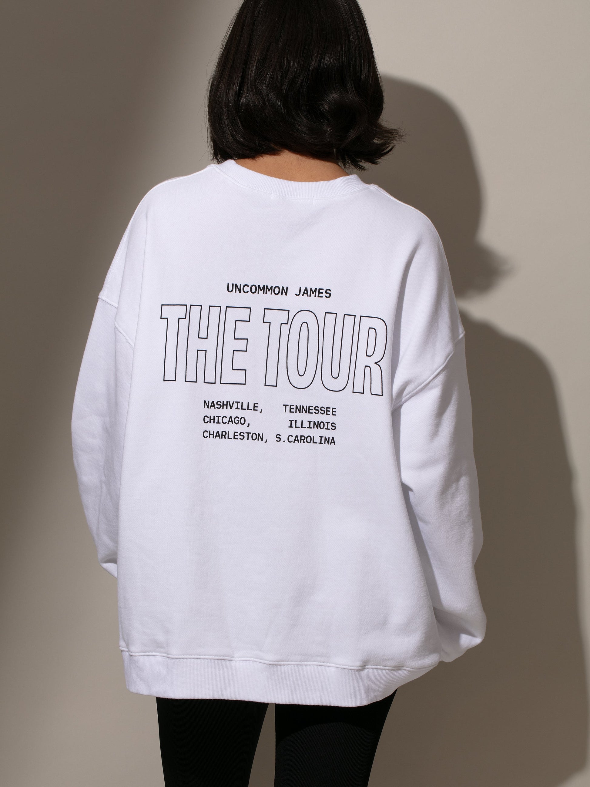 UJ Tour Sweatshirt | White | Model Image 2| Uncommon Lifestyle