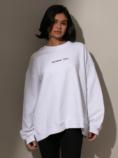 ["UJ Tour Sweatshirt ", " White ", " Model Image ", " Uncommon Lifestyle"]