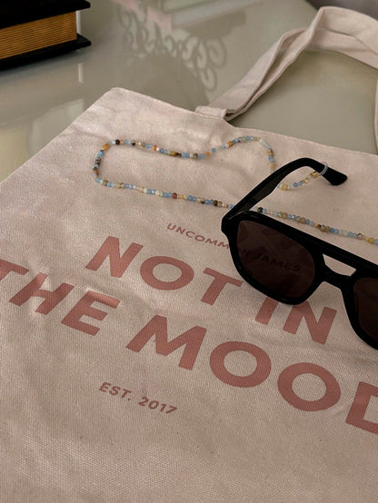 ["Not In The Mood Canvas Tote Bag ", " Lifestyle Image ", " Uncommon Lifestyle"]
