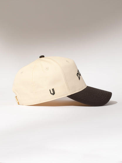 ["Dunzo Trucker Hat ", " Charcoal/Tan ", " Product Image ", " Uncommon Lifestyle"]
