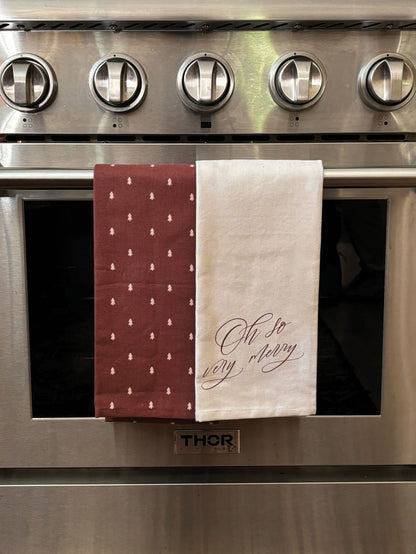 ["Merry Dish Towel (Set of 2) ", " Lifestyle Image ", " Uncommon Lifestyle"]