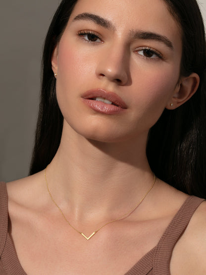 ["Baby V Necklace ", " Gold Solid ", " Model Image ", " Uncommon James"]