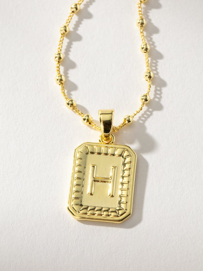 ["Sur Necklace ", " Gold H ", " Product Image ", " Uncommon James"]