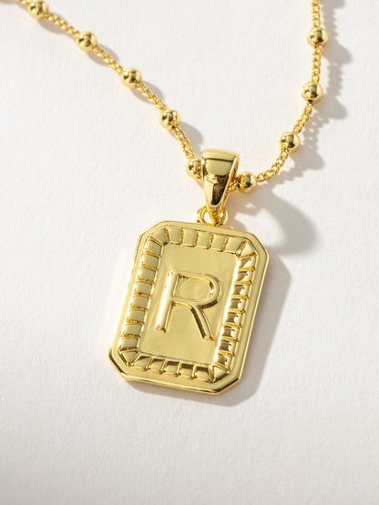 ["Sur Necklace ", " Gold R ", " Product Image ", " Uncommon James"]