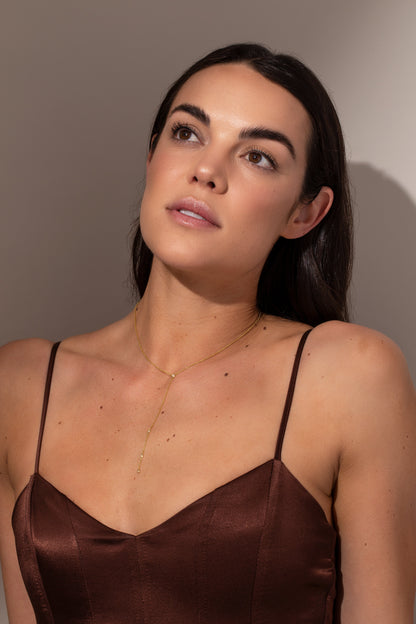 ["Soft Touch Lariat Necklace ", " Gold ", " Model Image ", " Uncommon James"]
