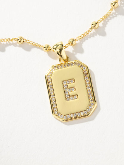 ["Sur 2.0 Necklace ", " Gold E ", " Product Detail Image ", " Uncommon James"]