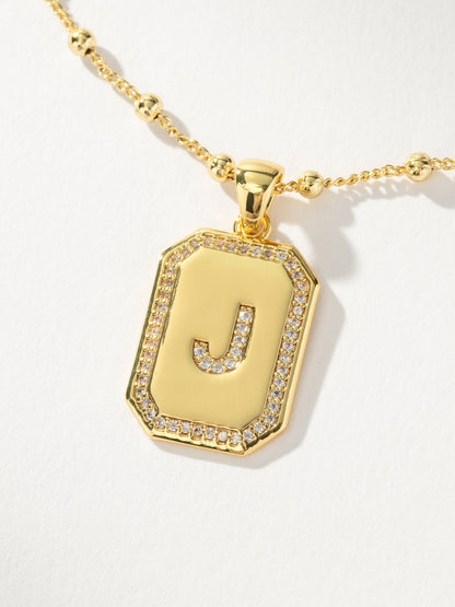 ["Sur 2.0 Necklace ", " Gold J ", " Product Detail Image ", " Uncommon James"]