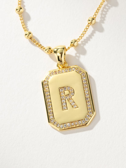 ["Sur 2.0 Necklace ", " Gold R ", " Product Detail Image ", " Uncommon James"]