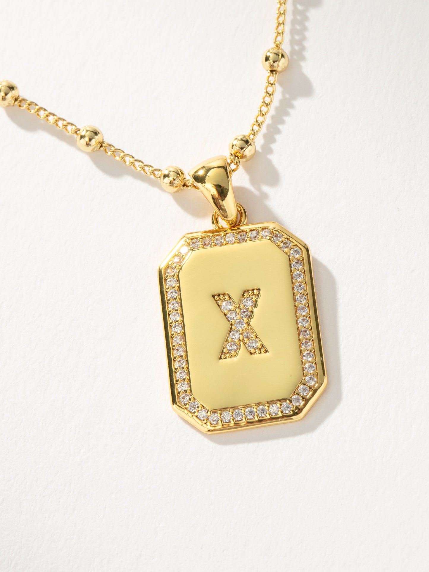 Sur 2.0 Necklace | Gold X | Product Detail Image | Uncommon James