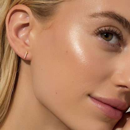 ["Cut Throat Stud Earrings ", " Gold ", " Model Image ", " Uncommon James"]