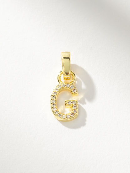["Letter Charm ", " Pavé Gold G ", " Product Image ", " Uncommon James"]