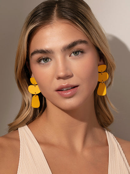 ["Nudist Earrings ", " Gold Yellow ", " Model Image ", " Uncommon James"]