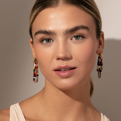 ["Resin Link Earrings ", " Pink Resin ", " Model Image ", " Uncommon James"]