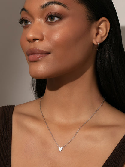 ["Mini White Heart Necklace ", " Sterling Silver ", " Model Image ", " Uncommon James"]