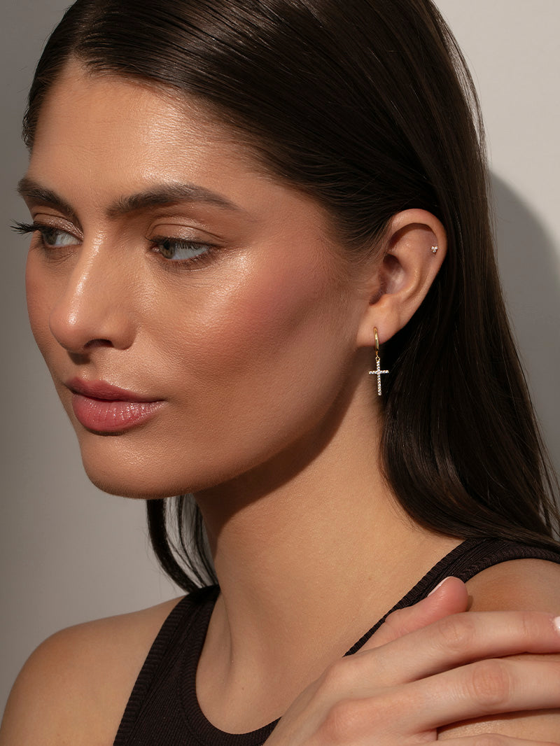 Pavé Cross Huggie Earrings | Gold | Model Image | Uncommon James