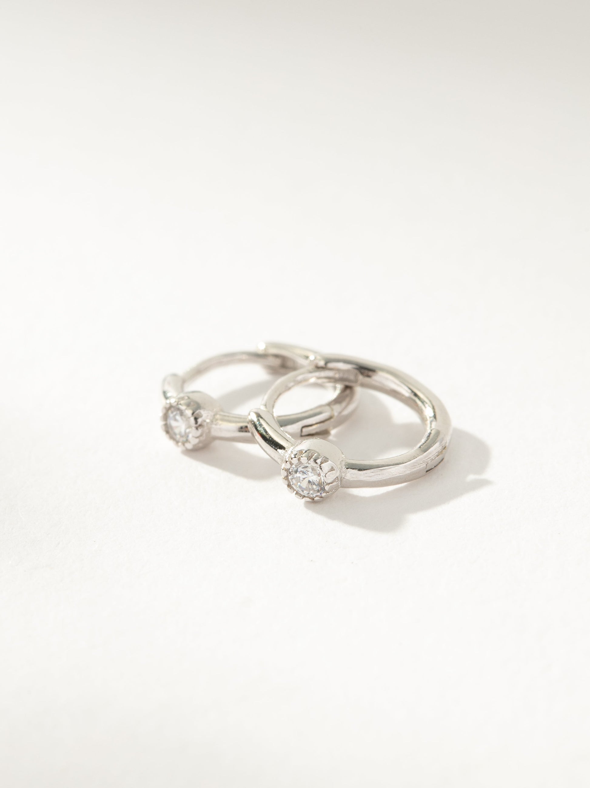 Center Stage Huggie Earrings | Sterling Silver Clear | Product Image | Uncommon James