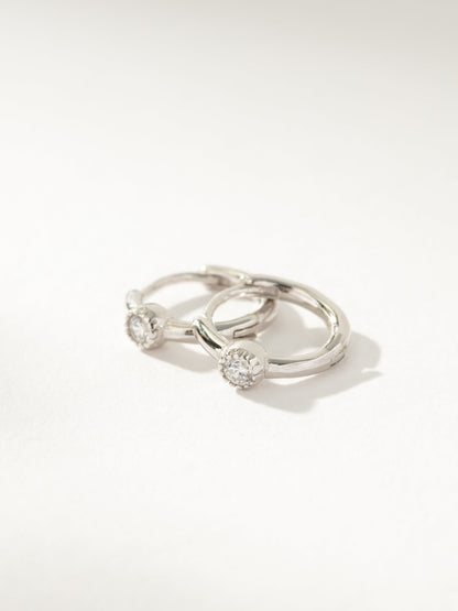 Center Stage Huggie Earrings | Sterling Silver Clear | Product Image | Uncommon James