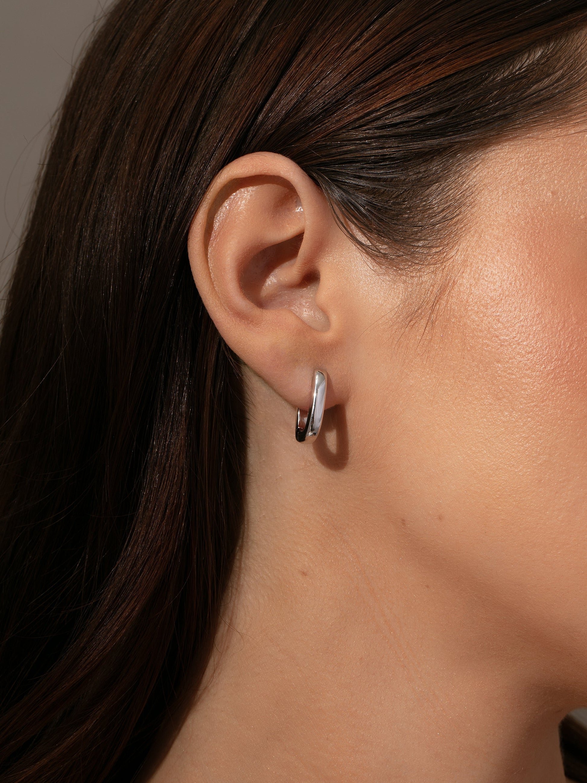 Oval Huggie Earrings | Silver | Model Image | Uncommon James