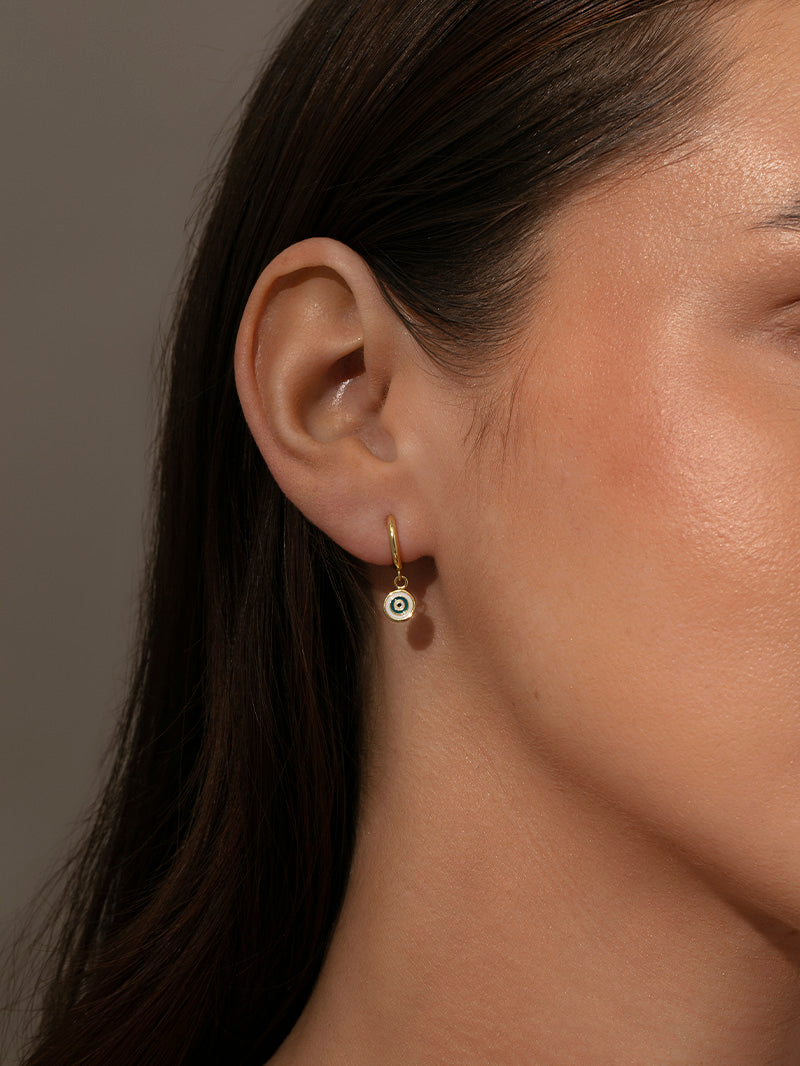 Simple Evil Eye Huggie Earrings | Gold | Model Image | Uncommon James
