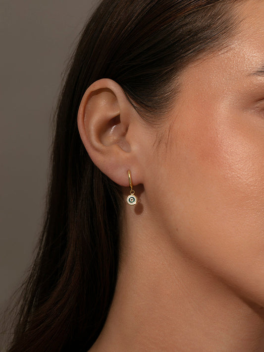 Simple Evil Eye Huggie Earrings | Gold | Model Image | Uncommon James