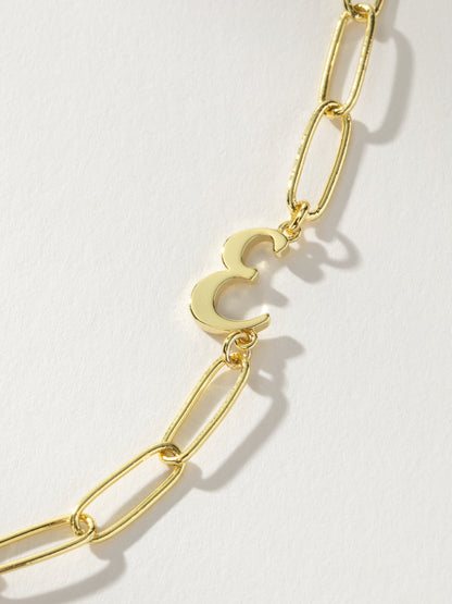 ["Cursive Initial Necklace ", " Gold E ", " Product Detail Image ", " Uncommon James"]