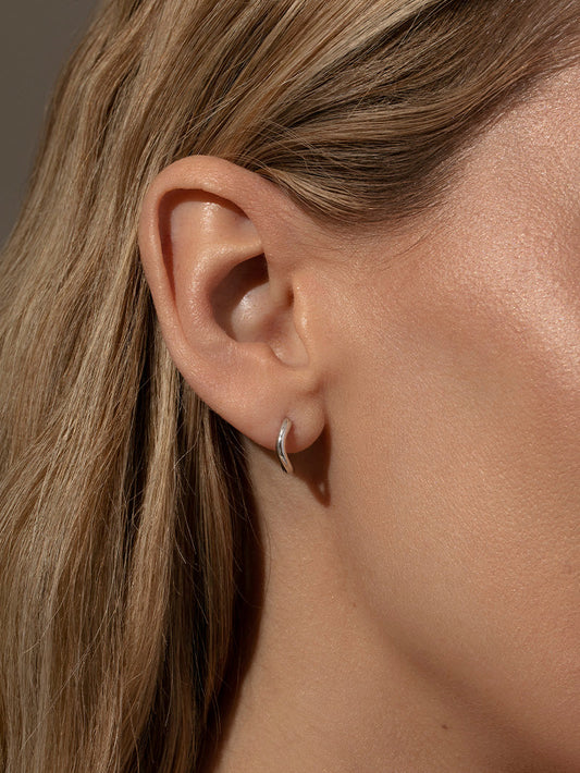 Curve Huggie Earrings | Silver | Model Image | Uncommon James