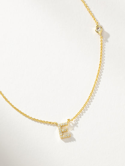 ["Pavé Initial Necklace ", " Gold E ", " Product Detail Image ", " Uncommon James"]
