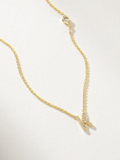 ["Pavé Initial Necklace ", " Gold K ", " Product Detail Image ", " Uncommon James"]