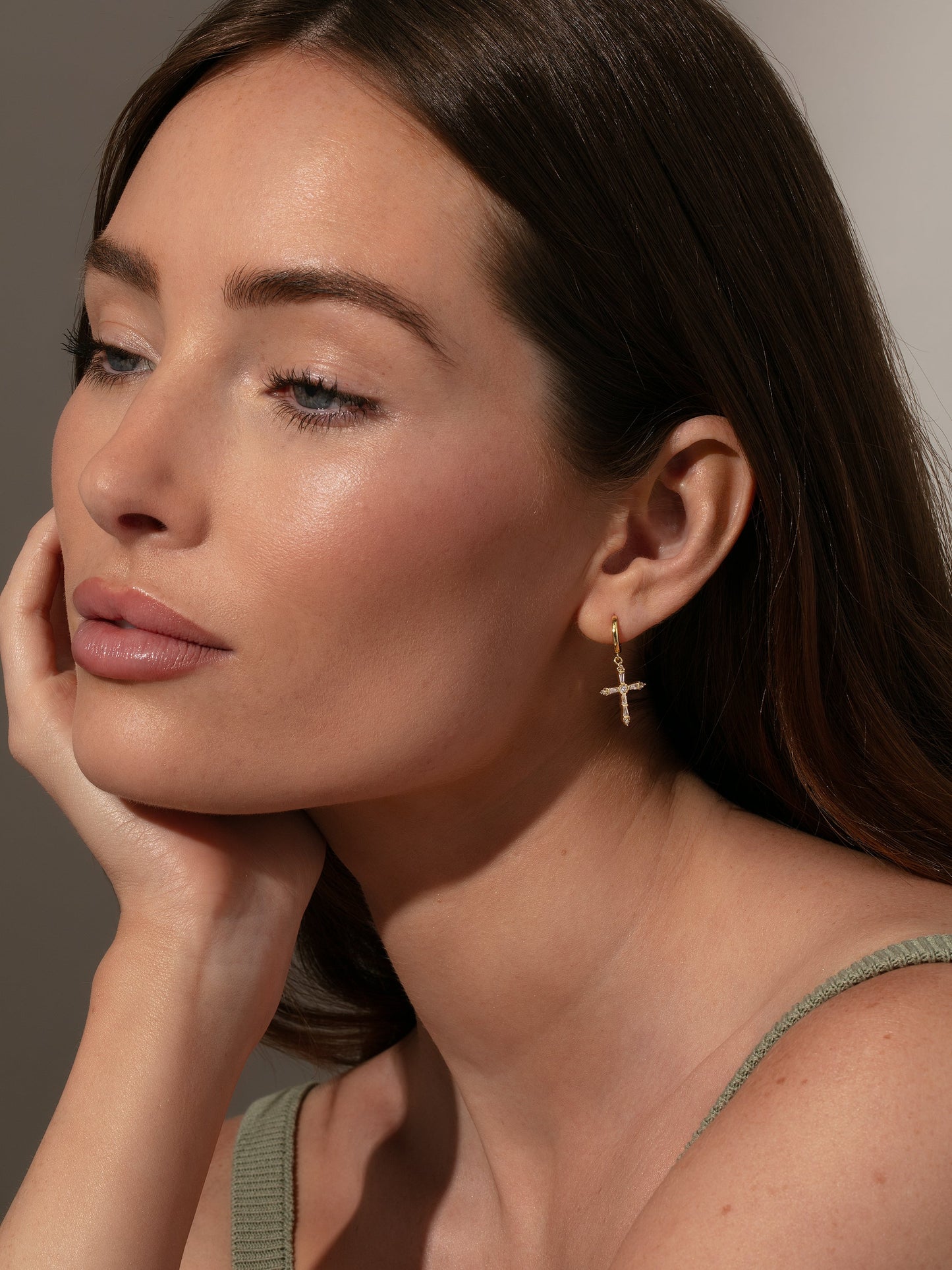 Crystalized Cross Huggie Earrings | Gold | Model Image | Uncommon James