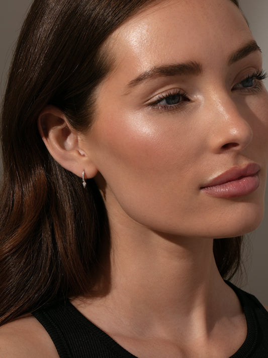 Tipping Point Pavé Huggie Earrings | Sterling Silver | Product Image | Uncommon James