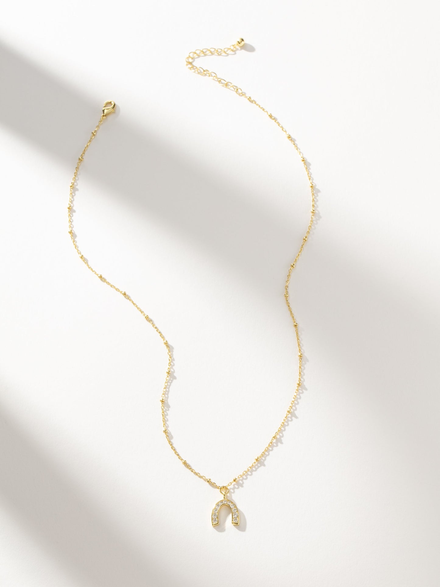 Horseshoe Pendant Necklace | Gold | Product Image | Uncommon James