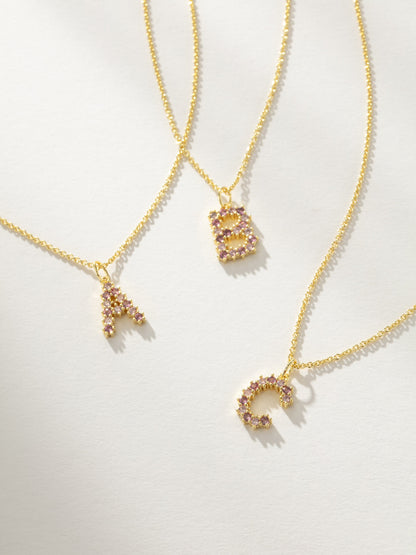 ["Pretty In Pink Initial Necklace ", " Gold ", " Group Image ", " Uncommon James"]