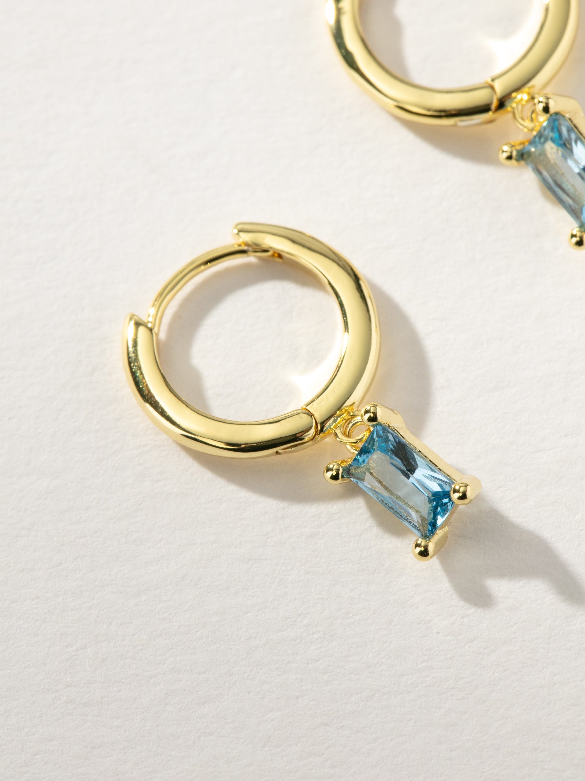 Birthstone Huggie Earrings | Gold December | Product Detail Image | Uncommon James