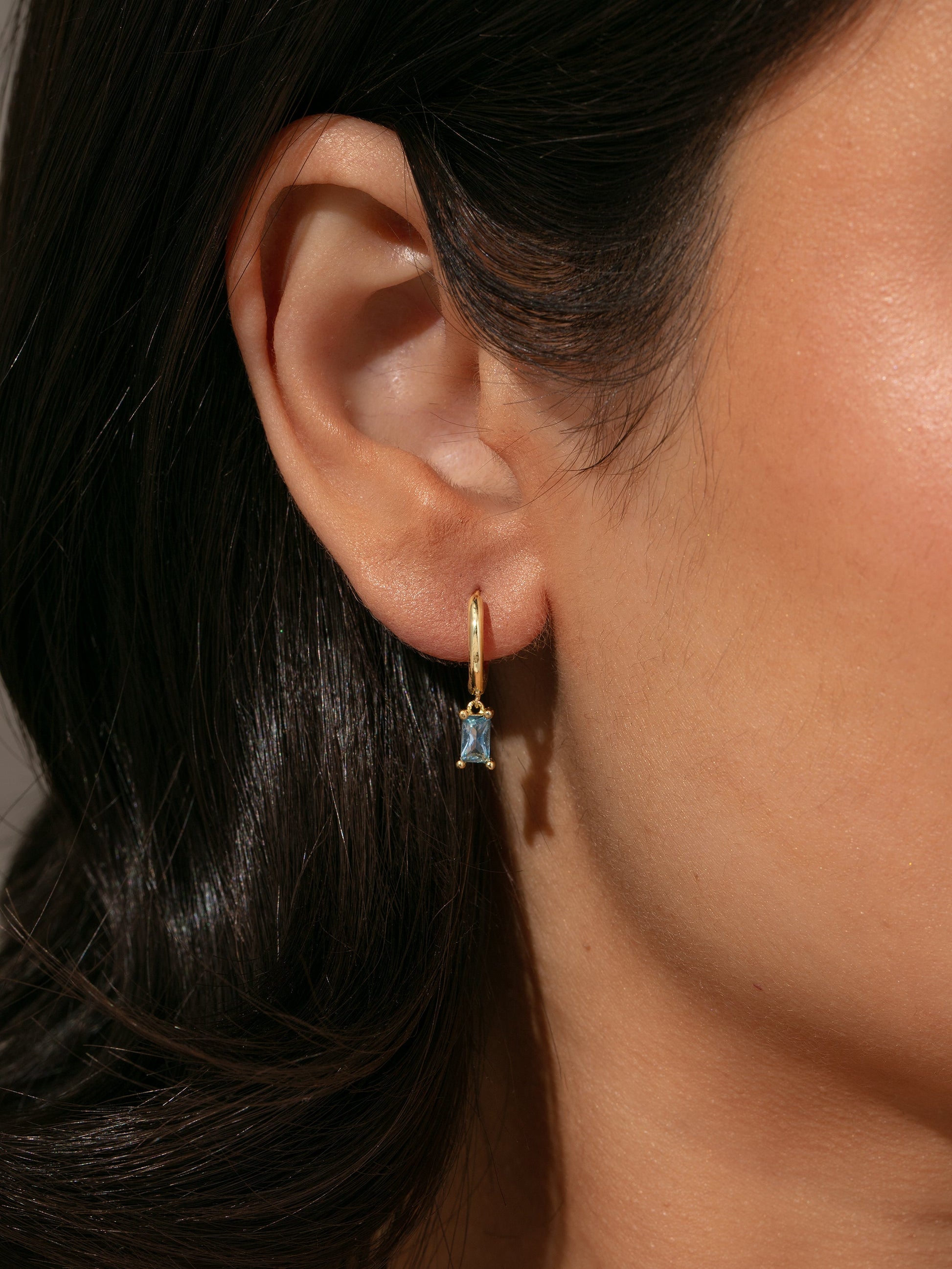 Birthstone Huggie Earrings | Gold | Model Image | Uncommon James