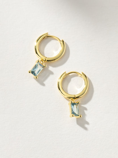 ["Birthstone Huggie Earrings ", " Gold March ", " Product Image ", " Uncommon James"]