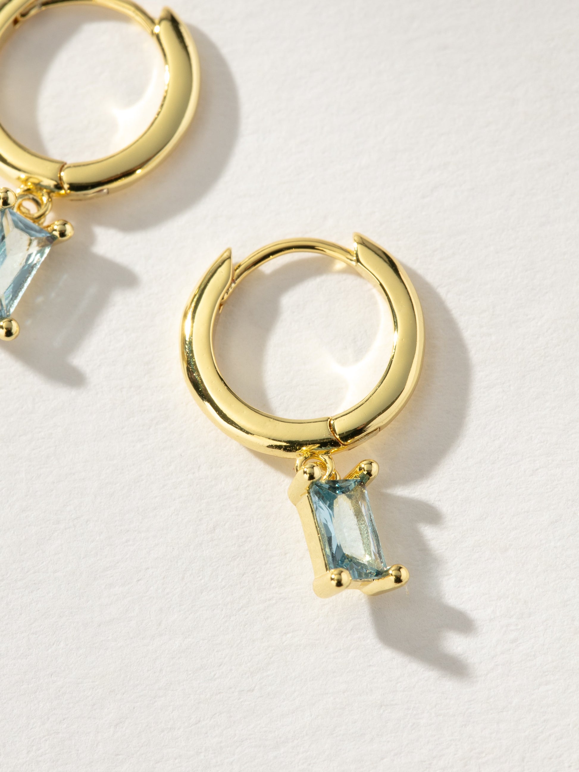 Birthstone Huggie Earrings | Gold March | Product Detail Image | Uncommon James