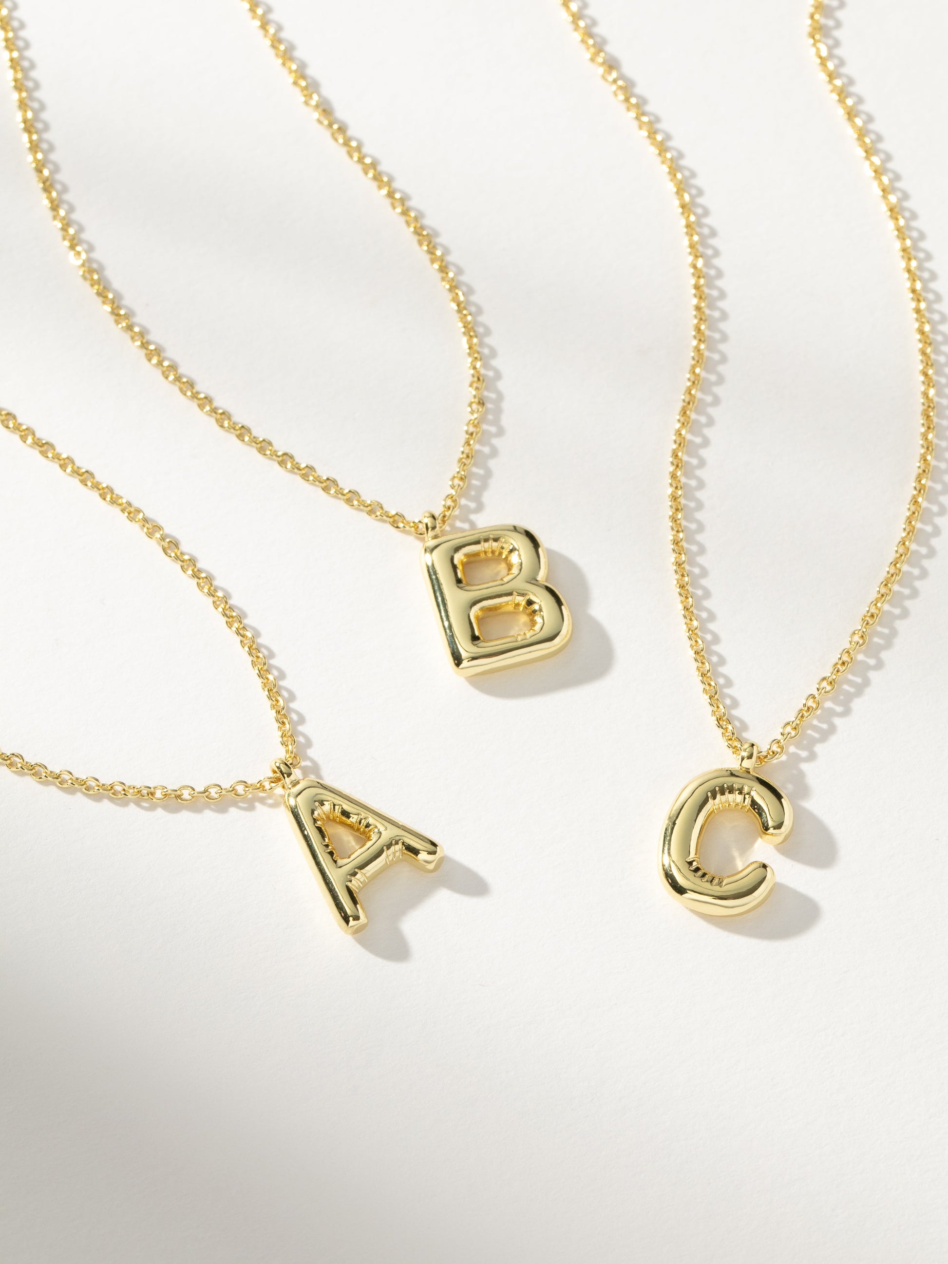 Bubble Letter Necklace | Gold | Group Image | Uncommon James